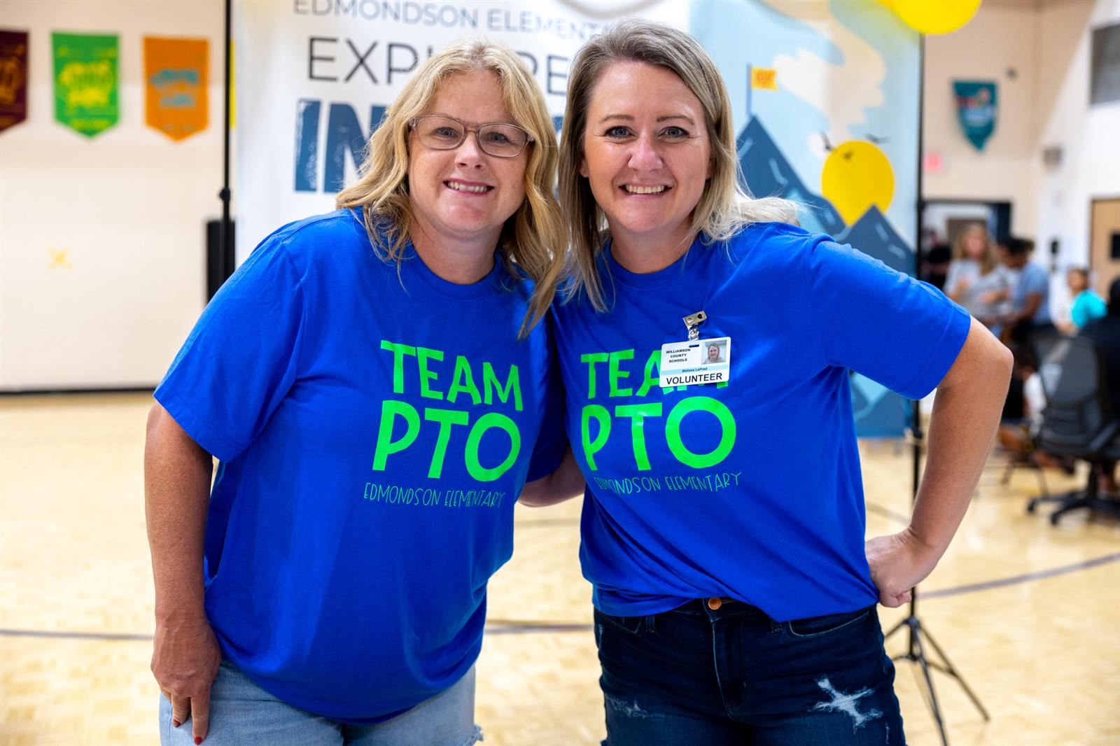 Two volunteers at a table